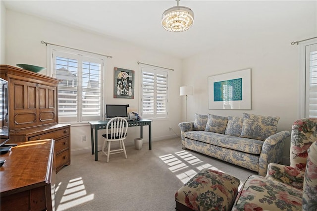 home office featuring light colored carpet and baseboards