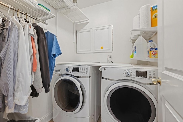 clothes washing area with laundry area and washer and clothes dryer