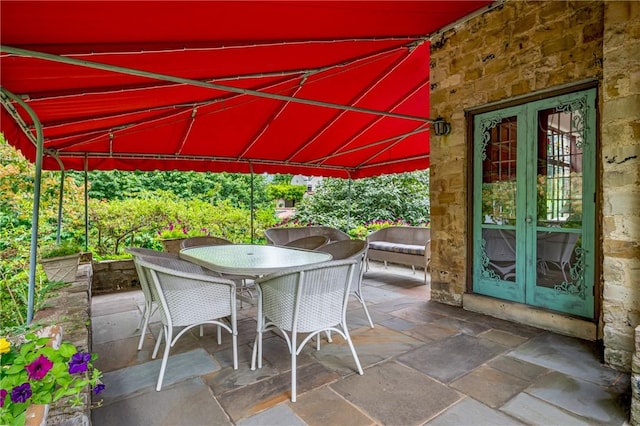 view of patio / terrace featuring outdoor dining area and french doors