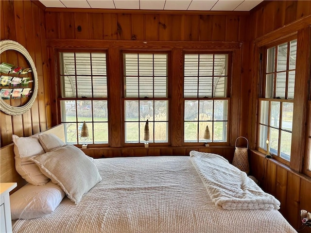 bedroom with wood walls