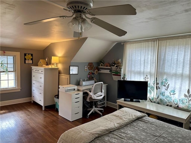 bedroom featuring baseboards, lofted ceiling, ceiling fan, and dark wood-style flooring