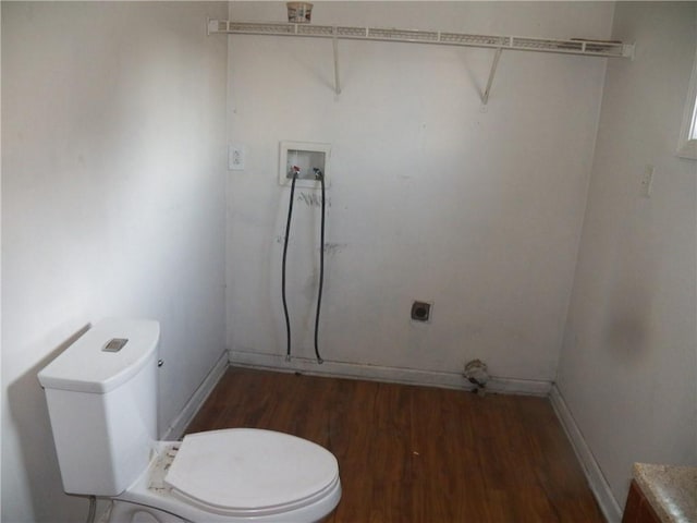 washroom featuring laundry area, wood finished floors, baseboards, and hookup for an electric dryer