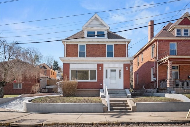 traditional style home with brick siding