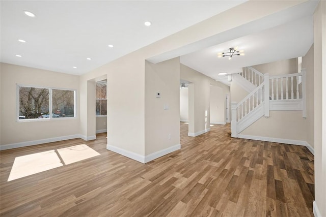 interior space featuring stairway, recessed lighting, light wood-style floors, and baseboards