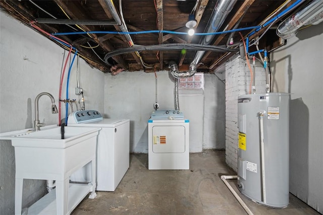 unfinished basement featuring washer and dryer and electric water heater