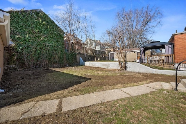 view of yard featuring a gazebo and fence