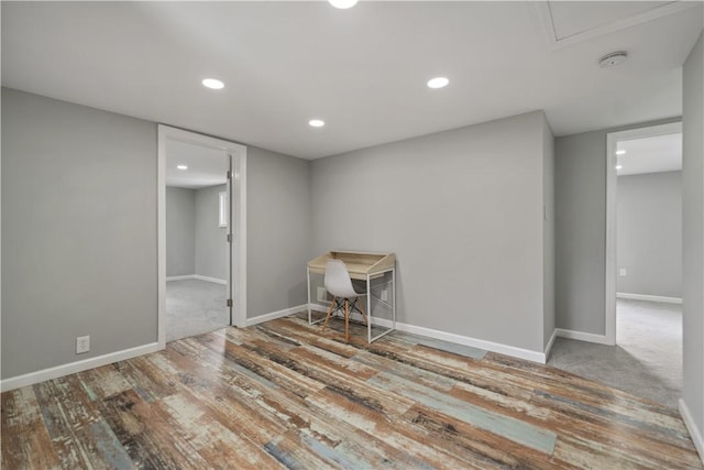 interior space featuring recessed lighting, baseboards, and wood finished floors