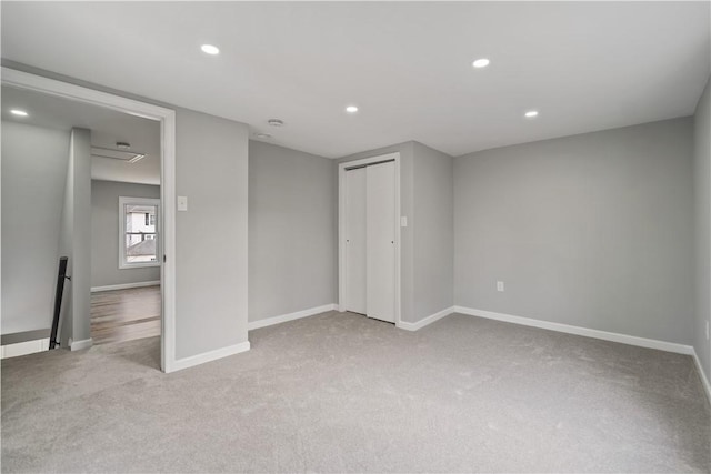 interior space featuring recessed lighting, baseboards, carpet floors, and a closet