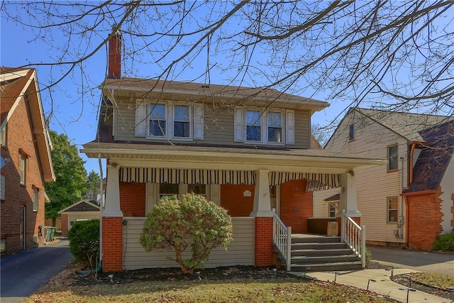 view of front of property with brick siding and covered porch