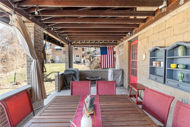 view of patio / terrace featuring grilling area and outdoor dining area