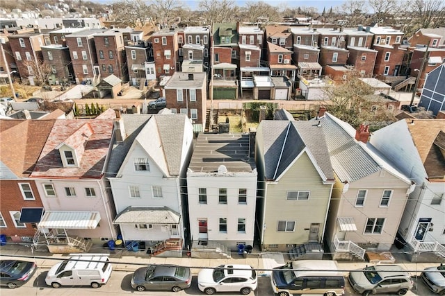 birds eye view of property with a residential view