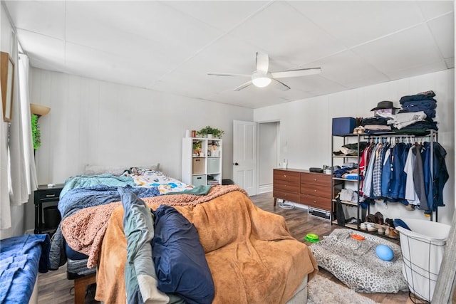 bedroom featuring a ceiling fan and wood finished floors