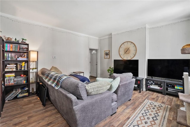 living room featuring crown molding and wood finished floors