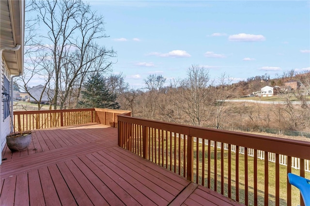 wooden deck with a lawn