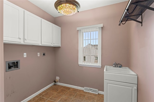 washroom with visible vents, hookup for an electric dryer, cabinet space, a sink, and washer hookup