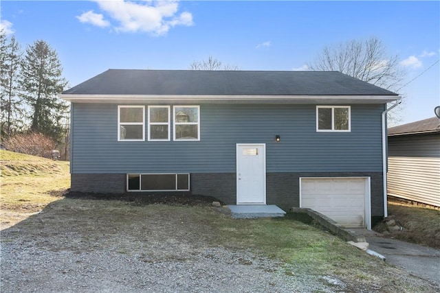 view of front of property with driveway and an attached garage