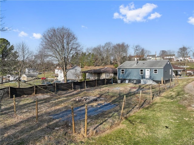 back of property featuring fence