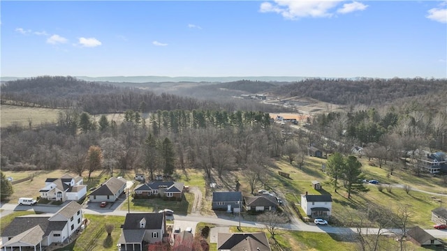 birds eye view of property with a forest view