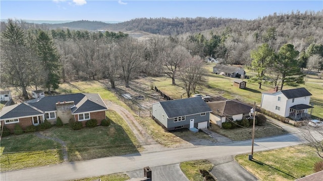 bird's eye view featuring a mountain view and a wooded view