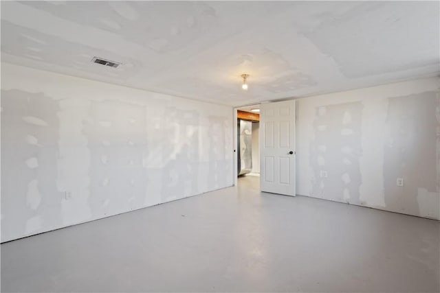 unfurnished room featuring visible vents and concrete flooring