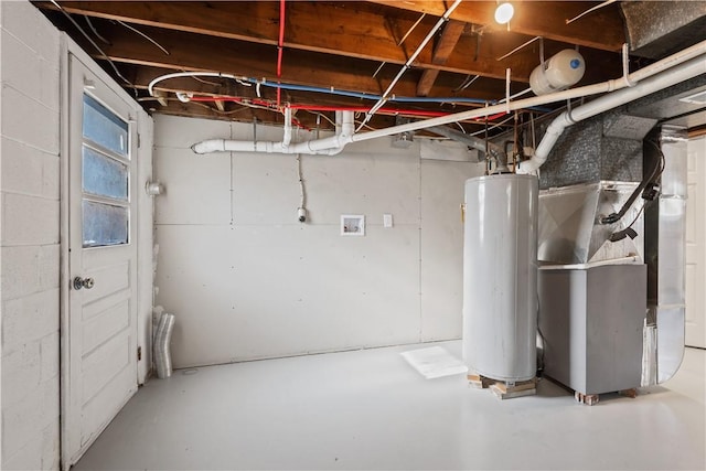 basement featuring water heater and heating unit