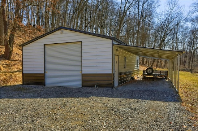 view of outbuilding featuring an attached carport and an outdoor structure