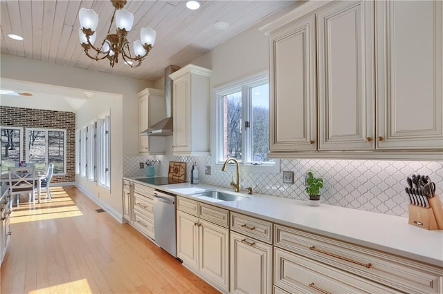 5125 Bear Run Rd, Cranberry Twp, PA 16066 - kitchen with a sink, stainless steel dishwasher, wall chimney exhaust hood, cream cabinetry, and light countertops