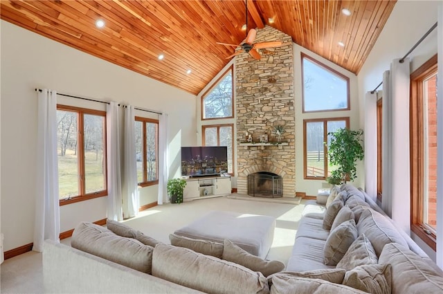 living area with ceiling fan, wooden ceiling, carpet flooring, and high vaulted ceiling