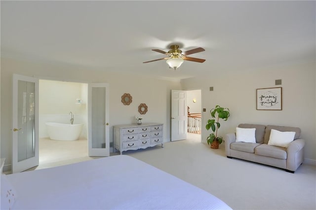 carpeted bedroom featuring visible vents, ceiling fan, ensuite bathroom, and french doors