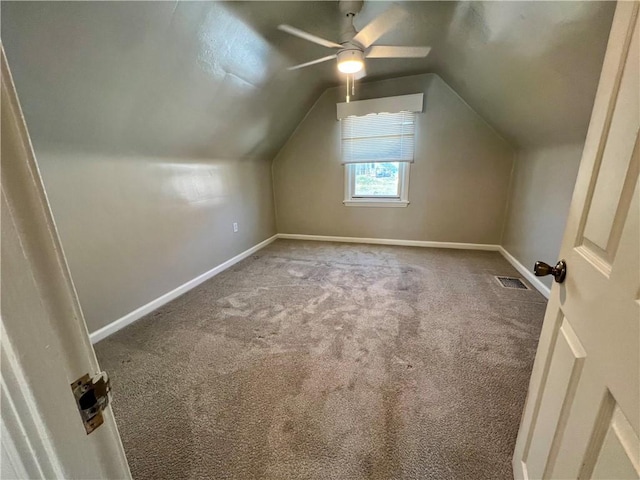 bonus room with visible vents, baseboards, ceiling fan, vaulted ceiling, and carpet flooring