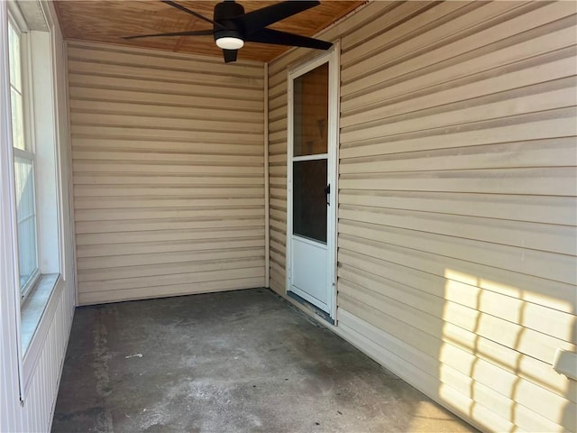 entrance to property featuring a ceiling fan