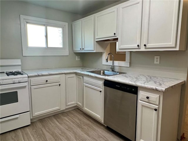 kitchen featuring white cabinetry, light wood-style flooring, a sink, stainless steel dishwasher, and white gas range