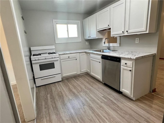 kitchen with light wood-type flooring, white range with gas cooktop, dishwasher, and white cabinetry