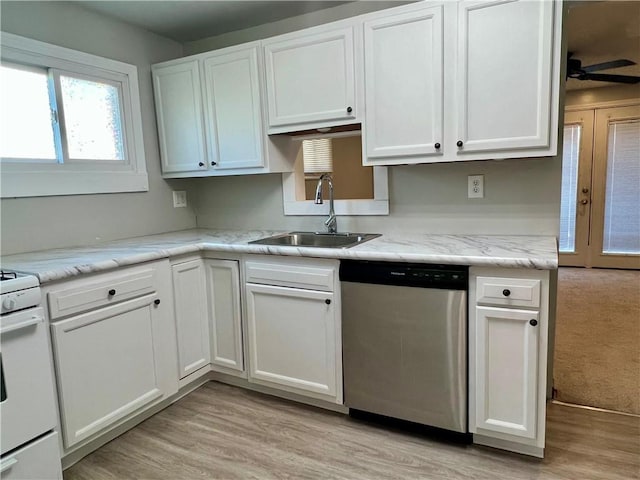 kitchen featuring white gas stove, ceiling fan, a sink, white cabinets, and stainless steel dishwasher