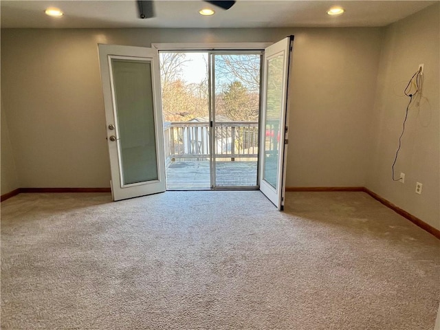 carpeted spare room with recessed lighting and baseboards