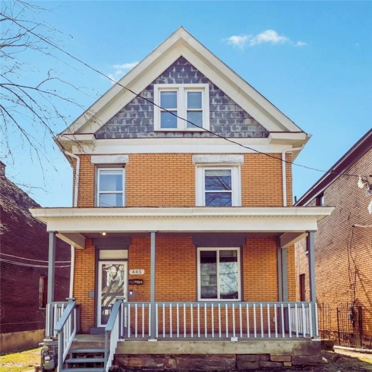 445 Eleanor St, Pitcairn, PA 15140 - view of front of property with a porch and brick siding