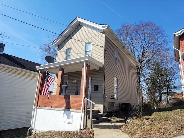 view of property exterior featuring covered porch