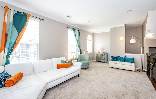 living room with crown molding, carpet flooring, baseboards, and visible vents