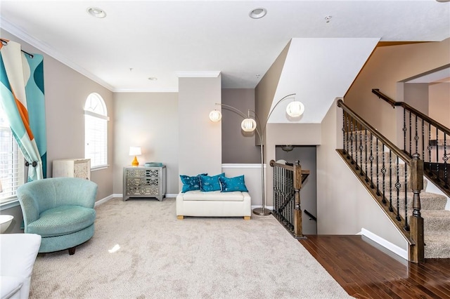 sitting room with an upstairs landing, ornamental molding, wood finished floors, recessed lighting, and baseboards
