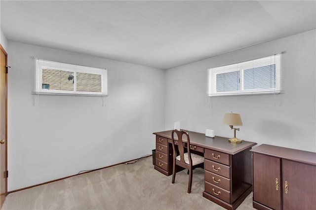 office space with light colored carpet and a healthy amount of sunlight