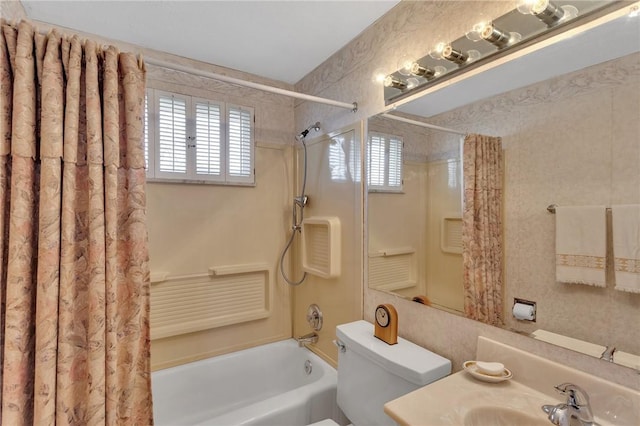 full bathroom with shower / tub combo with curtain, vanity, and toilet