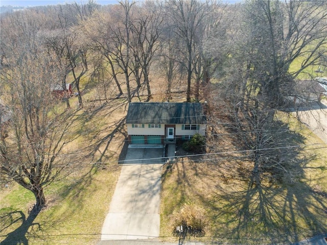 aerial view featuring a wooded view