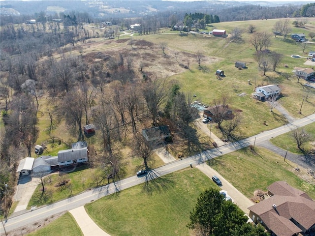 birds eye view of property with a rural view