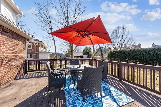 deck with outdoor dining area