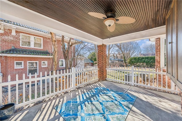 view of patio featuring fence and ceiling fan