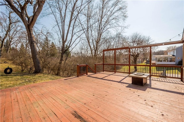 deck featuring a fire pit