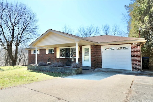 ranch-style house featuring a garage, brick siding, concrete driveway, and a front lawn