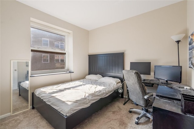 carpeted bedroom with baseboards