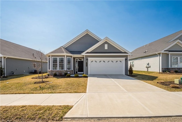 craftsman house featuring concrete driveway, a garage, and a front yard