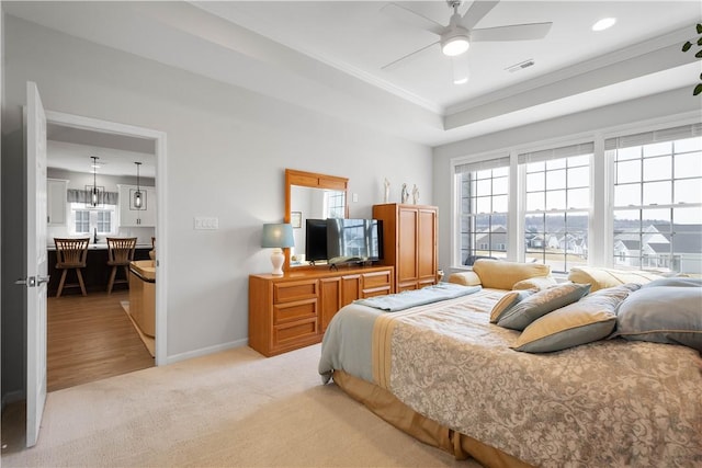 bedroom featuring visible vents, baseboards, a tray ceiling, light carpet, and recessed lighting